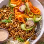 Chicken Banh Mi Bowl with pickled veggies, sriracha mayo, and rice.